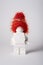 Moscow, Russia - July 26, 2022. White figure in the form of a lego in a New Year\\\'s hat on a white background