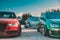 Moscow, Russia - July 6, 2019: Red Audi A4 and Green Volkswagen Golf sports and tuned cars are parked in the parking lot. Alloy