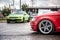 Moscow, Russia - July 6, 2019: Red Audi A4 and Green Volkswagen Scirocco. sports and tuned cars are parked in the parking lot.