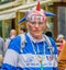 Moscow, Russia - July 7, 2018: Portrait of elderly French fan with football attribute in blue-white-red tricolor, flag