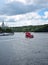 Moscow, Russia - July 8, 2019: Red pleasure boat on the Moskva river. The view from the Berezhkovskaya embankment