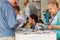 Moscow, Russia - June 02, 2019: Festival visitors and consultants of book publishers communicate on a background of stands with