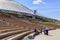 Moscow, Russia - June 03, 2018: Tourists sit on a bench on a Large amphitheatre in Zaryadye Park on a sunny summer morning