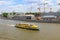 Moscow, Russia - June 03, 2018: Yellow pleasure boat floating on a background of Sofiyskaya embankment of Moskva river on a sunny