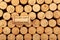 Moscow, Russia, June 06, 2022 | One wine cork with stamping GEORGIAN WINE lies on used cork stoppers. Selective focus. Concept -