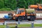 Moscow, Russia - June 09, 2018: Municipal modern cleaning trucks on footpaths in the public park at summer day