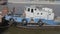 MOSCOW , RUSSIA, June 10, 2019: Old tug pushes a barge down a work on the river inscription on board "Kuzma"