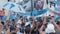 MOSCOW, RUSSIA, JUNE 20, 2018: Soccer World Cup Argentine football fans with flags at the on Nikolskaya Street, a crowd