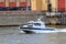 Moscow, Russia - June 21, 2018: Police boat rushing along water surface of Moskva river on a summer day