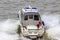 Moscow, Russia - June 21, 2018: Police boat rushing along water surface of Moskva river on a sunny summer day