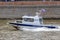 Moscow, Russia - June 21, 2018: Police boat rushing on Moskva river in historical center of Moscow on a summer day