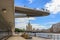 Moscow, Russia - June 21, 2018: Soaring bridge in Zaryadye Park on a background of stalinist skyscraper on Kotelnicheskaya embankm