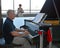 MOSCOW, RUSSIA. The male pianist plays on grand pianos in the waiting room of the Yaroslavl station