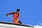 Moscow, Russia, March, 06, 2018. The worker of municipal service clear a roof from the accumulated snow in Moscow