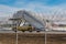 Moscow, Russia - March 14, 2019: Aviation ladder moving on territory of Vnukovo airport in Moscow on the background of metal mesh