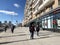 Moscow, Russia, March, 15, 2022. People walking past the house 38 on Krasnaya Presnya Street in the spring. Moscow, Russia