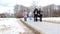 Moscow, Russia - March 21, 2019: People walking in winter park, weekend activities in the city