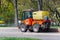 Moscow, Russia - May 01, 2019: Small sprinkler truck clean by water road sidewalk in sunny spring morning