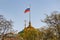 Moscow, Russia - May 01, 2019: Waving flag of Russian Federation above dome of Grand Kremlin Palace in Moscow closeup on a blue