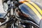 Moscow, Russia - May 04, 2019: Black fuel tank of Harley Davidson motorcycle with emblem and two yellow strip closeup. Moto