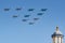 Moscow, Russia - May 07, 2019: Fighters Su-35S and Su-30SM with bombers Su-34 in the blue sky over Red Square in the group
