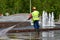 Moscow, Russia, May, 08, 2018. Man cleaning the territory of the fountain `the Abduction of Europe` in Moscow