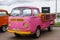 Moscow. Russia - May 20, 2019: Pink and yellow Volkswagen transporter T2 pickup Hippie bus are parked on the street. Aged vintage