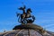 Moscow, Russia - May 27, 2018: Sculpture of Saint George the Victorious on the dome of World Clock Fountain on Manezhnaya square