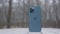 MOSCOW, RUSSIA-NOVEMBER, 2020: Back of new iPhone. Action. New stylish iPhone stands on background of park and snow. New