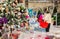 Moscow, Russia, November 2020: Masked shoppers view and choose Christmas toys at a Christmas sale in the Shopping Mall