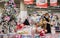 Moscow, Russia, November 2020: a young masked woman looks at and selects Christmas toys at a Christmas sale in a shopping Mall