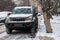 MOSCOW, RUSSIA,NOVEMBER,28.2018:Abandoned snow covered car Toyota Land Cruiser on a big city street.Consequences of snowfall