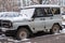 MOSCOW. RUSSIA.NOVEMBER ,30.2018:Powerful gray abandoned SUV UAZ hunter in the yard of a house