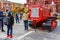 Moscow, Russia - October 05, 2019: Elderly man are photographed against a restored old soviet caterpillar tractor Stalinets on the