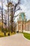 Moscow, Russia - October 16, 2019: Man and woman walking on alley against restored building of Grand Palace in Tsaritsyno Park in