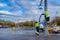 Moscow. Russia. October 19, 2020 Two workers in yellow uniforms assemble a road sign on a lamppost on a city street
