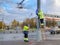 Moscow. Russia. October 19, 2020 Two workers in yellow uniforms assemble a road sign on a lamppost on a city street