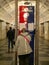 Moscow, Russia - October 5, 2021: Woman stands near the information board and studies the scheme of the Moscow metro. Vertical