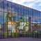 Moscow, Russia. Patriarchal Compound of Churches in Zaryadye is reflected in the glass facade of the building. Zaryadye Park,