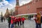 Moscow, Russia. Red Square. Joyful tourists and travelers are photographed for memory.