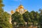 Moscow, Russia - September 02, 2018: Cathedral of the Annunciation on Moscow Kremlin territory against blue sky and green trees in