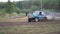 Moscow, Russia - September 2018: Cars take part in annual off-road races. Clip. Close-up of SUVs passing on dirty track