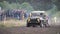 Moscow, Russia - September 2018: Cars take part in annual off-road races. Clip. Close-up of SUVs passing on dirty track