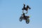 Moscow / Russia - September 23 2017: Pro motocross rider riding fmx motorbike, jumping performing extreme stunt. Professional