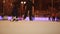 Moscow. Skating rink in the open air. People skate in the winter. Evening time. Christmas lights.