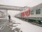 The Moscow-Vladivostok train is at the station. A man with a child is landing