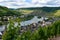 Mosel river, hills with vineyards and the old town Zell, Germany