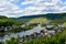 Mosel river, hills with vineyards and the old town Zell, Germany