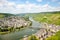 Moselle Valley Germany: View from Landshut Castle to the old town Bernkastel-Kues with vineyards and river Mosel in summer