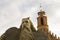 Moses statue and a belfry of a gothic church in a background